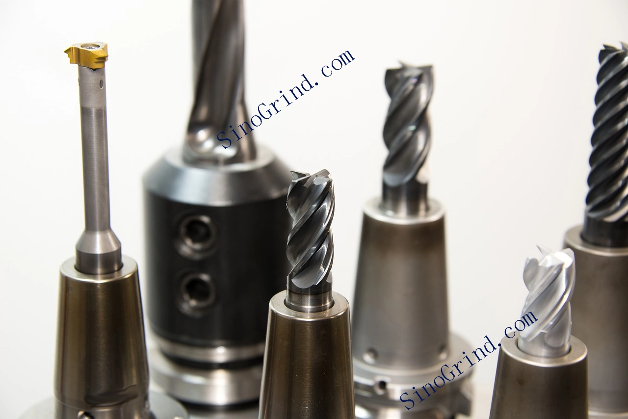 A comprehensive array of CNC end mills, drills, and inserts organized by material and application.